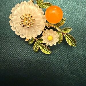 Elegant Floral Brooch with Orange and Gold Accents